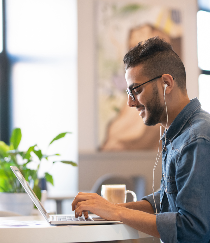 man in headphones using laptop 1